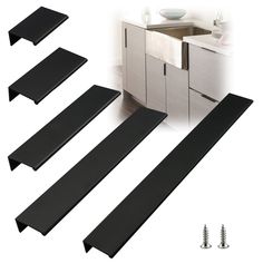 four pieces of black plastic sitting on top of a white counter next to a sink