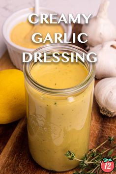 creamy garlic dressing in a jar with fresh herbs