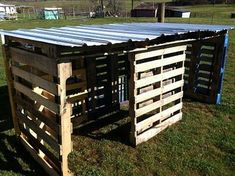 two wooden pallets sitting in the grass