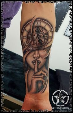 a person with a clock tattoo on their arm