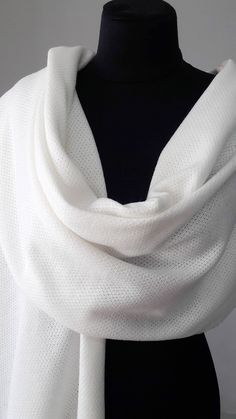 A warm and beautiful shawl made of ivory knitted mixed fabric, perfect to wear everyday or on a special occasion, wedding, party and other. Beautiful shawl to to warm you up on a cold but beautiful day... to add an elegant touch to your look. For more wedding tops and boleros, please access https://www.etsy.com/shop/LidiasBoutiqueDesign?ref=seller-platform-mcnav&section_id=23157300. For more wedding dresses, please access https://www.etsy.com/shop/LidiasBoutiqueDesign?ref=seller-platform-mcn White Shawl Scarves As Gift, Elegant Handmade Scarves For Weddings, Elegant White Shawl For Gift, White Wedding Pashmina Shawl, Elegant White Shawl As Gift, Elegant White Shawl Gift, Elegant White Shawl Wrap, White Winter Shawl As Gift, White Winter Shawl Perfect As A Gift