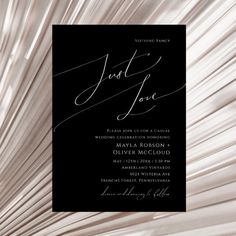 an elegant black and white wedding card with the word just love on it's front