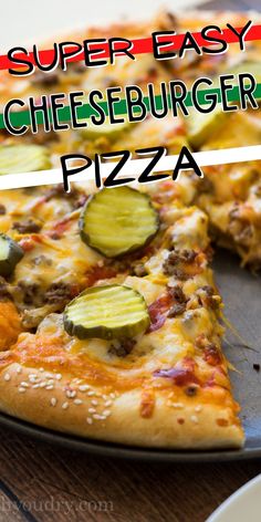 a pizza with cheeseburger and cucumbers on it is cut into slices