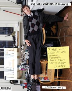 a young man standing on top of a chair next to a pile of clothes and shoes