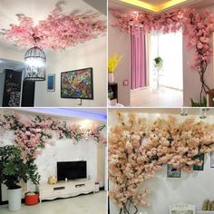 pink flowers are hanging from the ceiling and on the walls in this living room, along with other decorations