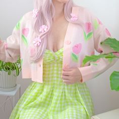 Step into whimsical Spring with our cropped fit jacquard cardigan, adorned with a charming tulip pattern in soft pastel pinks and greens! The comfortable fit ensures ease of wear, whether you're dressing up with a flowing dress or keeping it casual with your favorite jeans. Embrace the soft florals with this versatile piece that effortlessly adds a touch of enchantment to your look! 🌷💚 Details: ♡ 100% Acrylic ♡ Jacquard knit ♡ Model is 5'8" wearing a size Medium. *Please look at the size chart Spring Fitted Cardigan With Floral Print, Spring Fitted Floral Print Cardigan, Cute Long Sleeve Summer Cardigan, Feminine Pink Cardigan For Spring, Feminine Pink Spring Cardigan, Pink Feminine Cardigan For Day Out, Trendy Pink Cardigan For Spring, Feminine Pink Cardigan For Day Out, Cute Long Sleeve Spring Cardigan