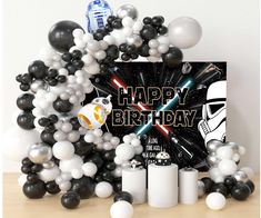 a star wars birthday party with black and white balloons