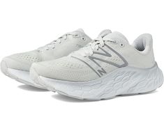 the new balance running shoe is white and grey