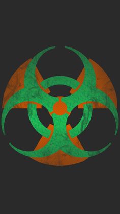 a green and orange biohazard sign on a black background with an orange center