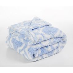 two blue and white towels stacked on top of each other