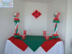 the table is decorated with red, green and white candy canes as centerpieces