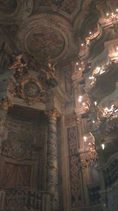 an ornately decorated room with chandeliers and lights