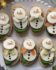 there are many sandwiches with frosting on them that look like snowmen and penguins