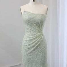 Upgrade your wedding party look with our Sparkly Sage Green Mermaid Evening Dress. The shimmering fabric and mermaid silhouette will make you stand out while the sage green color adds a touch of elegance. Perfect for formal events, this dress is sure to make you feel like a true mermaid. window.adminAccountId=244214477; Green Mermaid Dress With Sweep Train, Green Mermaid Gown With Sweep Train, Glamorous Green Mermaid Dress With Sweep Train, Green Floor-length Mermaid Dress With Sweep Train, Green Fishtail Mermaid Dress With Fitted Bodice, Green Fishtail Dress For Wedding, Green Fishtail Wedding Dress, Bridesmaid Mermaid Dress With Sweep Train, Glamorous Green Mermaid Gown