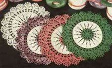 four crocheted doily on a table