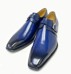 Style: 2337-2308-Navy Spectacular & Completely Handmade, this Hand Burnished Calfskin Slip-on Monkstrap Shoe from the Ugo Vasare collection features Goodyear Welted construction, Goldtone Buckle closure, soft Calfskin lining, cushioned insole, a stitched welt and a Full Leather sole! Matching Belt Available. Don't See Your Size? Call us to arrange a Special Order. Luxury Blue Monk Strap Shoes For Formal Occasions, Luxury Blue Monk Strap Shoes For Business, Luxury Goodyear Welted Monk Strap Slip-on Shoes, Luxury Blue Monk Strap Business Shoes, Elegant Blue Monk Strap Shoes With Leather Sole, Classic Monk Strap Slip-on Shoes With Stitched Sole, Luxury Slip-on Monk Strap Shoes With Goodyear Welt, Goodyear Welted Slip-on Monk Strap Shoes, Calf Leather Slip-on Monk Strap Shoes With Leather Sole