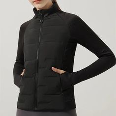 Stay warm and stylish with our Women's Ultralight Sport Puffer Jacket, the ultimate puffer jacket for active women. Perfect for running and outdoor activities, this puffer jacket features seamless splicing, down insulation, and a lightweight design for ultimate comfort. The sleek, modern look ensures you stay on-trend, while the functional design offers practicality for your active lifestyle. Whether you're hitting the trails or running errands, our puffer jacket keeps you cozy without compromis Black Midweight Athleisure Outerwear, Sporty Quilted Puffer Jacket For Outdoor Activities, Stretch Winter Sports Outerwear, Sportswear Puffer Jacket For Outdoor Activities, Lightweight Nylon Sports Outerwear, Black Stretch Functional Outerwear, Functional High Stretch Nylon Outerwear, Sporty Windproof Puffer Jacket With Long Sleeves, Sporty Long Sleeve Windproof Puffer Jacket