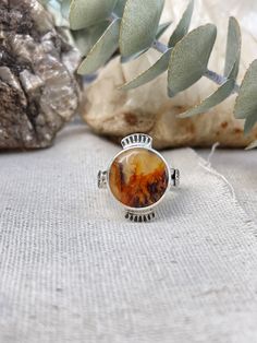 This is a very cool looking plume agate stone. It looks like a little fire! Set in sterling silver and hand stamped detailing around the bezel as well as on the band.  This ring is size 7. This ring was handmade by me in my studio. Southwest Aesthetic, Island Jewelry, Plume Agate, Fire Ring, Handmade Sterling Silver Rings, Rings Cool, Brass Jewelry, Pink Opal, Polish Jewelry