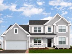 a large gray house with red shutters on the front and side windows, two car garage doors, and green grass in front