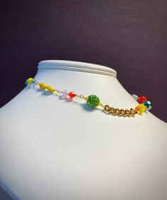 NEW! Candy Charm Choker Necklace designed with a variety colorful beads including vintage beads, and Czech crystals. Two types of gold plated brass chain add to this original design. Lobster Claw Clasp Full Length 15 1/2" Handmade in Brooklyn, NY Multicolor Crystal Necklace With Beaded Chain For Parties, Colorful Beaded Chain Necklaces For Party, Colorful Beaded Chain Necklace For Party, Party Gold Crystal Necklaces With Colorful Beads, Gold Chain Necklace With Colorful Beads, Multicolor Beaded Chain For Jewelry Making, Colorful Beaded Chain Jewelry For Party, Multicolor Beaded Chain Necklace With Round Beads, Multicolor Beaded Jewelry For Mardi Gras