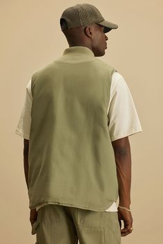 Available In Olive. 2 Front Pockets Front Button Closure Pair With "Alexander Utility Chore Jacket" Pair With "Alexander Utility Zip Work Jacket" Pair With " Alexander Utility Hooded Jacket" Pair With " Alexander Utility Overalls" Pair With "Alexander Double Knee Utility Pants" Pair With "Landon Stacked Skinny Flare Cargo Pants" Self: 100% Cotton Lining: 100% Polyester Padding: 100% Polyester Imported | Mens Alexander Utility Canvas Vest in Olive Green size 3XL by Fashion Nova Utility Overalls, Flare Cargo Pants, Canvas Vest, Olive Fashion, Utility Vest, Work Jacket, Utility Pants, Chore Jacket, Work Jackets