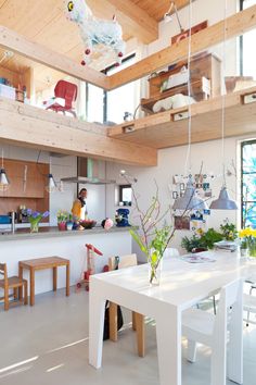 the kitchen is clean and ready for us to eat in this space, with plenty of natural light coming from the windows