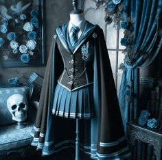 a black and white photo of a dress on a mannequin with a skull in the background