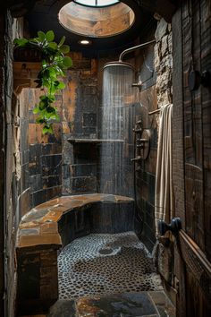 a bathroom with a skylight above the shower and stone flooring on the walls