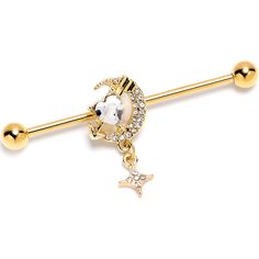 Product Details14 Gauge Clear Gem Gold Tone Moon Lover Dangle Industrial Barbell 38mm Fall in love with the night sky when you're rocking this 14 gauge helix barbell. It's made with a 1 1/2 inch gold tone plated over 316L surgical grade stainless steel straight barbell with 5mm ball ends. It features a crescent moon charm, paved with clear gems. Nestled in the curve of the moon is a clear gem heart, pierced with an arrow embellishment and also features an embellished star dangle. You can even sl Star Industrial Piercing, Moon Industrial Piercing Jewelry, Gold Industrial Piercing Bar, Industrial Piercing Jewelry Arrow, Industrial Piercing Diamond Bar, Industrial Earrings, Industrial Piercing Jewelry, Types Of Ear Piercings, Moon Lover