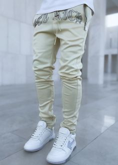 Men's Skinny Slim Fit Drawstring Trouser Cream Get Rich Track Pants Fitted Cotton Drawstring Pants, Fitted Cotton Joggers With Drawstring, White Fitted Pants With Drawstring, Fitted White Pants With Drawstring, Beige Drawstring Bottoms For Streetwear, Sporty Fitted Pants With Drawstring, Beige Stretch Pants With Drawstring, Fitted Drawstring Bottoms, Fitted Long Pants With Drawstring