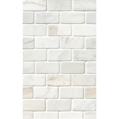 a white brick wall that is made out of marble