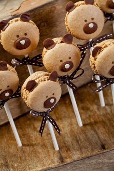 some brown teddy bears are on top of marshmallows in the shape of cookies