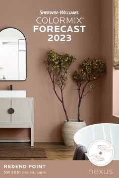 a bathroom with pink walls and white furniture