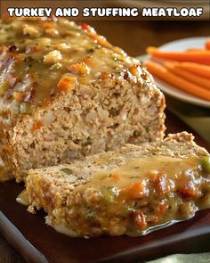 meatloaf with carrots and gravy on a plate