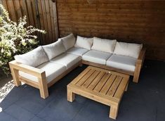 a couch and coffee table on a patio