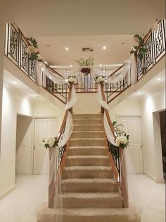 the stairs are decorated with flowers and ribbons