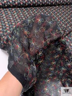 Content: 100% Cotton Color: Black / Multicolor Width: 65 inches Fitted Black Cotton Fabric, Multicolor Embroidered Fabric For Spring, Embroidered Multicolor Cotton Fabric, Black Embroidered Fabric With Intricate Details, Fabric Gifts, Fabric By The Yard, Alexander Mcqueen Scarf, Quality Fabric, Yard