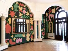 an elaborately decorated room with arched windows