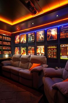 a movie theater with two recliners in front of a wall full of movies