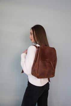 Introducing our exquisite leather backpack for women, a perfect blend of style, functionality, and personalized charm. Handmade with utmost care and attention to detail, this monogrammed backpack purse is a true testament to timeless craftsmanship.  Crafted from high-quality leather, it exudes elegance and durability, making it the ideal companion for both daily commutes and weekend getaways. With its spacious compartments and well-organized interior, it effortlessly accommodates your laptop, books, and all your essentials.  ⭐ Size: 13,4x10,2x3,5 in (34 x 24 x 9 cm) ⭐ Material: genuine leather ⭐ The main compartment is closed by tightening and covered with a valve. The valve closes on the magnet button. ⭐ Inside there is a pocket on the back wall (17 * 14cm). ⭐ The shoulder straps are adju Monogram Backpack, Custom Purses, Custom Backpack, Travel Purse, Women Leather Backpack, Stylish Backpacks, Cute Backpacks, Small Backpack, Designer Backpacks