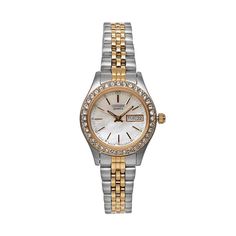 A crystal-accented bezel and mother-of-pearl dial make this women's stainless steel watch from Citizen a lovely way to infuse feminine charm into any ensemble. Comes in a gift box.FEATURES Calendar: day & date Water resistance: 30 meters Made with Swarovski Elements CASE & DISPLAY Mother-of-pearl dial Gold-tone hands & markers Face cover: mineral crystal Case & caseback: stainless steel Stones: crystal 26-mm diameter BAND Stainless steel Fold-over pushbutton deployment clasp Wome Stainless Steel Watch Women, Calendar Day, Two Tone Watch, Stainless Steel Watch, Steel Watch, Minerals Crystals, Face Cover, Quartz Movement, Mens Fashion Casual