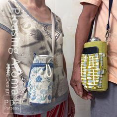 two people standing next to each other holding cell phones in their pouches and purses