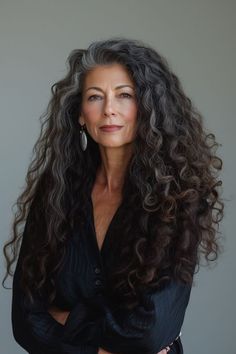 Long curly locks in deep espresso brown provide a luxurious and sophisticated hairstyle for women over 60. The rich brown color adds depth and elegance, making it perfect for those who prefer a refined and classic style. Grey Hair Model Older Women, Old Money Hair Curly, Older Woman Curly Hair, Grey Curly Hair, Layered Curly Hair, Long Curls, Curly Hair Women, Chic Hairstyles