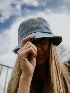 Here's an accessory that'll become your main outfit piece. Get yourself this trendy, comfortable, and versatile bucket hat that'll work for all kinds of outfits--casual, sporty, and streetwear.  * 100% cotton * 2 sewn eyelets on each side of the hat * Poplin sweatband * One size fits most * Blank product sourced from China Trendy Brimmed Cotton Sun Hat, Cotton Brimmed Bucket Hat, One Size Fits Most, One Size Cotton Brimmed Bucket Hat, Brimmed Cotton Bucket Hat, Casual Adjustable Brimmed Bucket Hat, Trendy Cotton Bucket Hat With Brim, Trendy Cotton Brimmed Bucket Hat, Trendy Brimmed Cotton Bucket Hat, Casual Adjustable Bucket Hat With Curved Brim