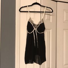 Never Worn! Black With Detailing Around Bust. Black Spaghetti Strap Top For Sleep, Black Sleeveless Coquette Camisole, Black Coquette Sleeveless Camisole, Black Sleeveless Camisole For Night, Black Sleeveless Coquette Top, Sheer Black Sleeveless Sleepwear, Black Sleeveless Sheer Sleepwear, Sleeveless Black Sheer Sleepwear, Black Sheer Sleeveless Sleepwear