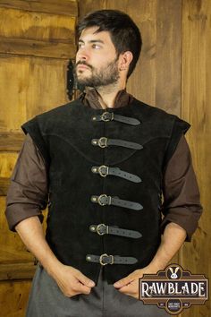 Unleash your medieval spirit with our exceptional split leather jacket for men. This versatile piece is the perfect addition to your LARP, historical reenactment, Renaissance fair or medieval event attire. Crafted from high-quality split leather, this jacket combines durability with a touch of robust elegance. Its timeless design and impeccable craftsmanship make it easy to combine with a variety of clothing items, allowing for seamless integration into your character's wardrobe. Whether you are Medieval Style Outerwear For Fantasy Events, Medieval Style Outerwear For Larp And Festivals, Medieval Style Outerwear For Larp And Medieval Festivals, Black Outerwear For Larp And Medieval Festivals, Medieval Outerwear For Larp With Historical Design, Medieval Fashion Men, Historical Reenactment, Middle Age Fashion, Medieval Fashion