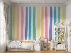 a child's bedroom with colorful stripes painted on the wall and bed in the foreground