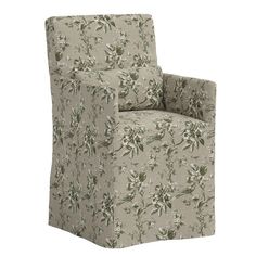 an upholstered chair with floral fabric