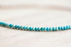 This ultra delicate bracelet is made up of tiny faceted natural Arizona mined turquoise beads with round metal beads in your choice of sterling silver, gold filled or rose gold filled. Minimal and chic on its own, or a lovely addition to any stack. Finished with a lobster clasp. These are genuine, untreated turquoise beads. You will see some natural variations in the beautiful color. Please choose your preferred style - half and half or alternating beads. Or choose the set of two! Turquoise is a Turquoise Single Strand Bracelet Gift, Turquoise Single Strand Bracelet As Gift, Turquoise Single Strand Bracelet For Gift, Turquoise Faceted Beaded Bracelets, Faceted Turquoise Beaded Bracelets, Faceted Turquoise Beaded Bracelets For Gift, African Turquoise Bracelet, Stacking Jewelry, African Turquoise