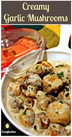 creamy garlic mushroom soup in a white bowl on a table with a glass dish full of mushrooms